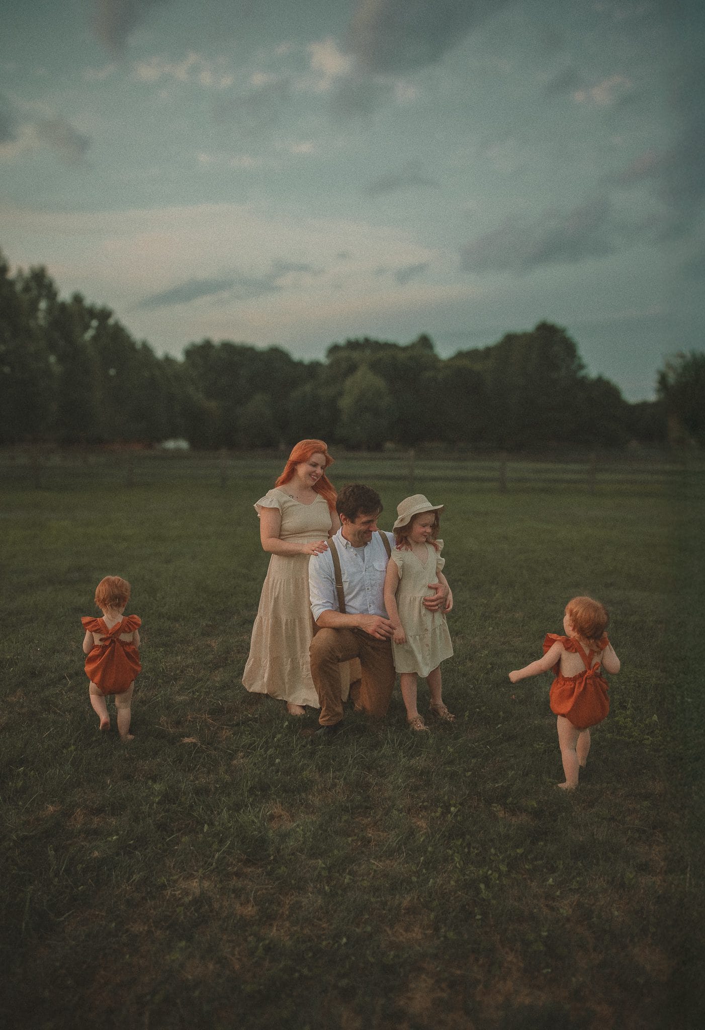 Connecticut family photographer captures golden hour field portrait with twin toddlers in East Hampton CT