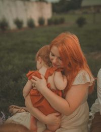 Mother hugging her young child during a lifestyle family photo session in Connecticut